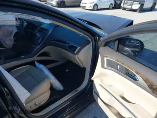 2016 Lincoln MKZ with VIN 3LN6L2G97GR624238, listed as a IAAI auction lot 41642853 with 205,832 mi miles. Bid and sale history available at carsss.com. Image 5.