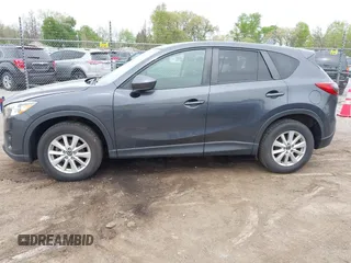 2014 Mazda CX-5 Touring with VIN JM3KE2CYXE0332517, listed as a IAAI auction lot 42109592 with 138,214 mi miles. Bid and sale history available at carsss.com. Image 14.