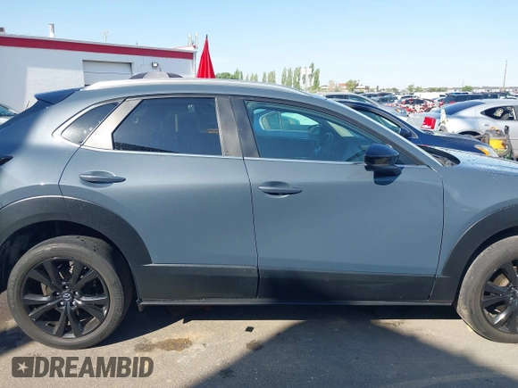 2022 Mazda CX-30 S Carbon Edition with VIN 3MVDMBCL6NM431985, listed as a IAAI auction lot 42610558 with Not provided miles and . Bid and sale history available at DreamBid. Image 12.