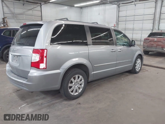 2013 Chrysler Town & Country Touring with VIN 2C4RC1BG9DR714736, listed as a IAAI auction lot 41824364 with 156,486 mi miles. Bid and sale history available at carsss.com. Image 4.