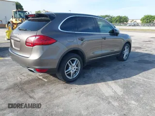 2011 Porsche Cayenne S Hybrid with VIN WP1AE2A29BLA94414, listed as a IAAI auction lot 41644386 with 76,095 mi miles. Bid and sale history available at carsss.com. Image 4.
