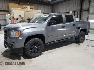 2022 GMC Canyon 4WD AT4 w/Leather with VIN 1GTG6FEN1N1175900, listed as a Copart auction lot 85957514 with 56,811 mi miles and Salvage Title. Bid and sale history available at carsss.com. Image 1.