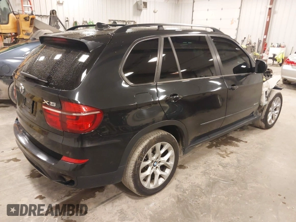 2012 BMW X5 35i with VIN 5UXZV4C55CL990510, listed as a IAAI auction lot 41849293 with 117,522 mi miles and . Bid and sale history available at DreamBid. Image 4.