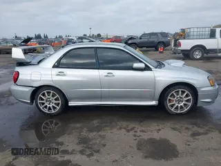 2005 Subaru Impreza Sedan (Natl) WRX STi w/Gold Wheels with VIN JF1GD70675L510065, listed as a IAAI auction lot 41092820 with 90,641 mi miles. Bid and sale history available at carsss.com. Image 13.