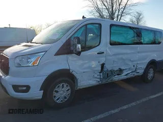 2021 Ford Transit Passenger XL with VIN 1FBAX2Y87MKA64167, listed as a IAAI auction lot 41087474 with 67,242 mi miles and . Bid and sale history available at DreamBid. Image 6.