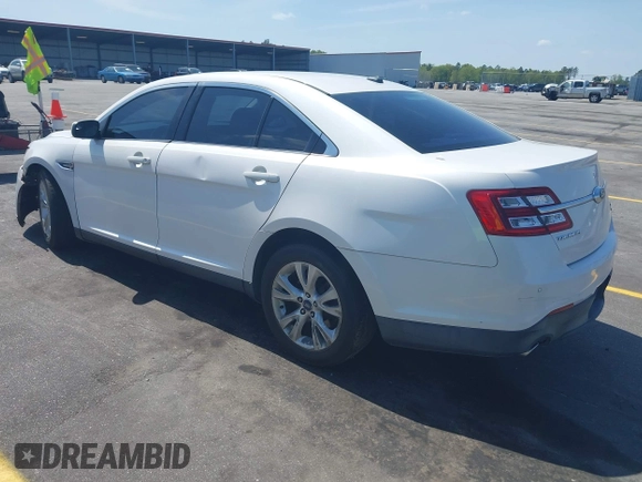2014 Ford Taurus SEL with VIN 1FAHP2E86EG132676, listed as a IAAI auction lot 41943392 with 183,633 mi miles. Bid and sale history available at carsss.com. Image 3.