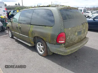 1999 Plymouth Voyager Grand SE z VIN 1P4GP44G0XB579719, wystawiony jako IAAI lot #41981925 z przebiegiem 163 940 mil mil oraz . Historia ofert i sprzedaży dostępna na DreamBid. Obrazek 3.