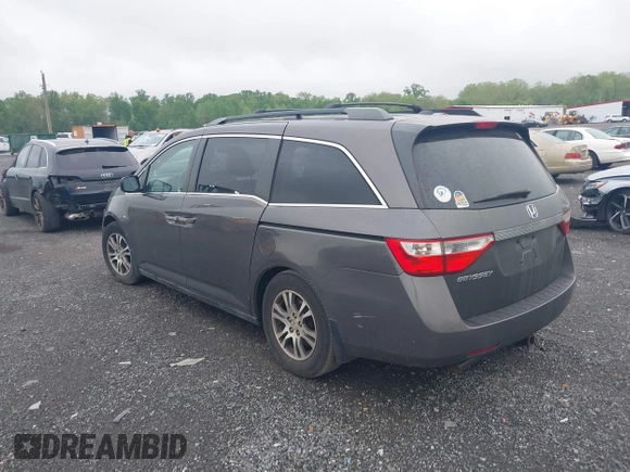 2012 Honda Odyssey EX-L with VIN 5FNRL5H64CB060468, listed as a IAAI auction lot 42182501 with 236,399 mi miles and . Bid and sale history available at carsss.com. Image 3.