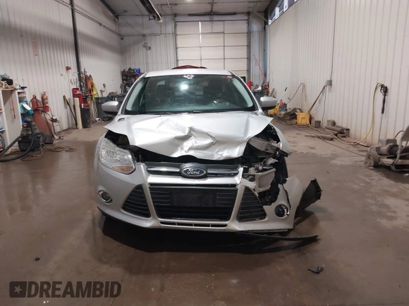 2012 Ford Focus SE with VIN 1FAHP3F21CL284921, listed as a IAAI auction lot 42054351 with 164,377 mi miles and . Bid and sale history available at carsss.com. Image 12.