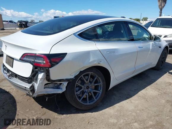 2020 Tesla Model 3 Standard Range Plus with VIN 5YJ3E1EA4LF644967, listed as a IAAI auction lot 41745984 with 23,479 mi miles and . Bid and sale history available at DreamBid. Image 4.