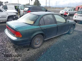 1997 Saturn SL with VIN 1G8ZK5276VZ329694, listed as a IAAI auction lot 41792109 with 208,002 mi miles and . Bid and sale history available at DreamBid. Image 4.