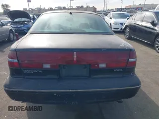 1997 Lincoln Continental with VIN 1LNLM97V5VY665410, listed as a IAAI auction lot 41239128 with 66,873 mi miles. Bid and sale history available at carsss.com. Image 16.
