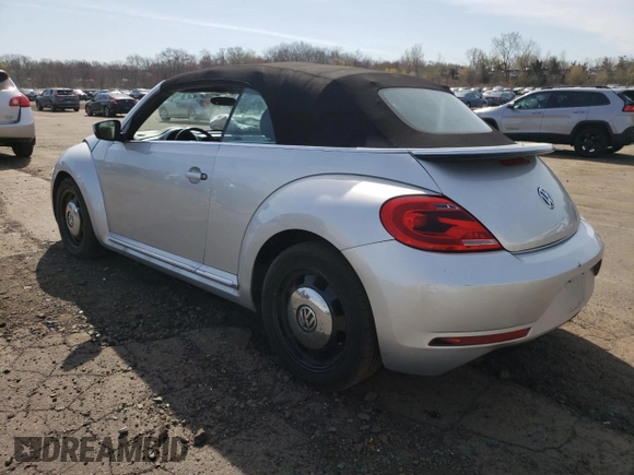 2013 Volkswagen Beetle 2.5L with VIN 3VW5P7AT0DM821280, listed as a Copart auction lot 53565635 with 94,969 mi miles and Salvage Title. Bid and sale history available at DreamBid. Image 2.