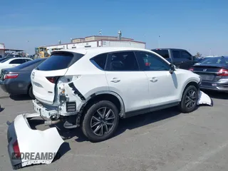 2018 Mazda CX-5 Touring with VIN JM3KFACM0J0416716, listed as a IAAI auction lot 42150121 with 61,332 mi miles and . Bid and sale history available at carsss.com. Image 14.