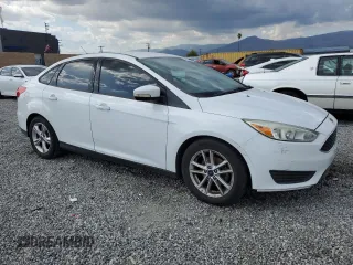 2016 Ford Focus SE with VIN 1FADP3F21GL284681, listed as a Copart auction lot 51140975 with 141,704 mi miles and Salvage Title. Bid and sale history available at DreamBid. Image 4.