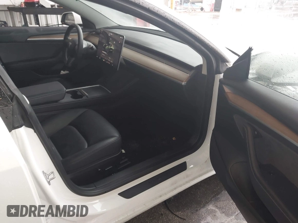 2023 Tesla Model 3 with VIN 5YJ3E1EA9PF548726, listed as a IAAI auction lot 42345157 with 30,647 mi miles and . Bid and sale history available at DreamBid. Image 5.