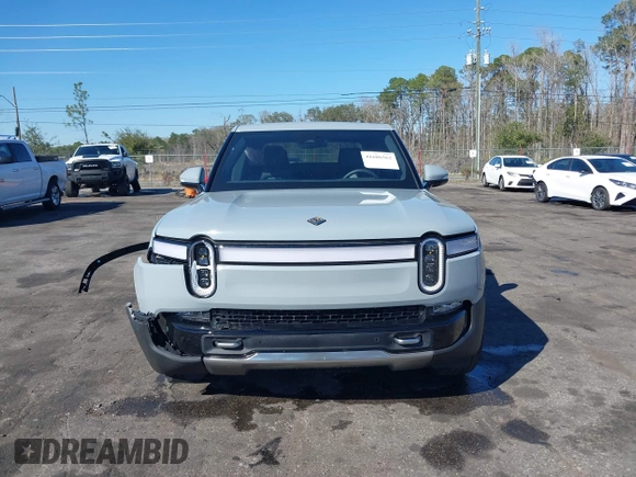 2024 Rivian R1T Adventure z VIN 7FCTGAAA5RN033799, wystawiony jako IAAI lot #41606562 z przebiegiem 9 449 mil mil oraz . Historia ofert i sprzedaży dostępna na DreamBid. Obrazek 12.
