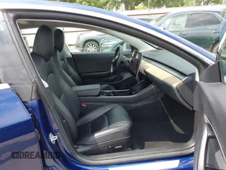2019 Tesla Model 3 Mid Range with VIN 5YJ3E1EA5KF190453, listed as a IAAI auction lot 41880684 with 58,909 mi miles and . Bid and sale history available at carsss.com. Image 5.