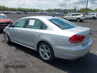 2014 Volkswagen Passat SE with VIN 1VWBT7A32EC070023, listed as a IAAI auction lot 42202567 with 116,438 mi miles and . Bid and sale history available at DreamBid. Image 3.