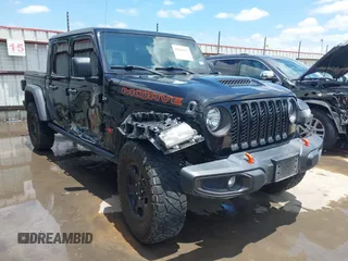 2021 Jeep Gladiator Mojave with VIN 1C6JJTEGXML569376, listed as a IAAI auction lot 42341117 with 59,661 mi miles and . Bid and sale history available at DreamBid. Image 1.