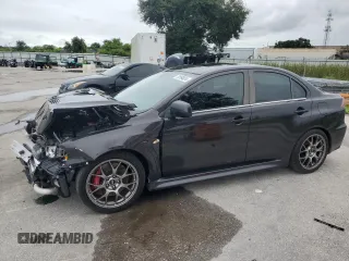2012 Mitsubishi Lancer Evolution MR with VIN JA32W5FV2CU031365, listed as a Copart auction lot 74764024 with 127,813 mi miles and Salvage Title. Bid and sale history available at carsss.com. Image 1.