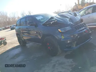 2018 Jeep Grand Cherokee SRT z VIN 1C4RJFDJ9JC382328, wystawiony jako IAAI lot #41620799 z przebiegiem 70 762 mil mil oraz . Historia ofert i sprzedaży dostępna na DreamBid. Obrazek 1.