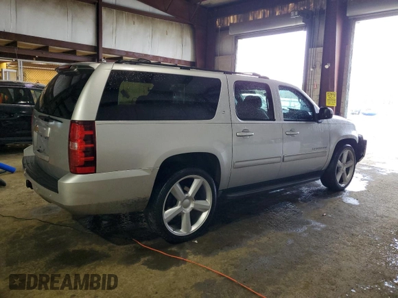 2013 Chevrolet Suburban LT with VIN 1GNSCJE00DR260275, listed as a Copart auction lot 50394425 with 140,464 mi miles and Salvage title. Bid and sale history available at DreamBid. Image 3.