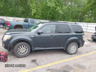 2009 Mercury Mariner Premier z VIN 4M2CU87759KJ17765, wystawiony jako IAAI lot #42354423 z przebiegiem 163 907 mil mil oraz . Historia ofert i sprzedaży dostępna na DreamBid. Obrazek 14.