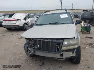 2004 Jeep Grand Cherokee Laredo with VIN 1J4GX48S44C301120, listed as a IAAI auction lot 41281556 with 267,246 mi miles. Bid and sale history available at carsss.com. Image 13.