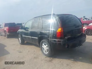 2006 GMC Envoy SLT with VIN 1GKDS13S062234137, listed as a IAAI auction lot 41561864 with 221,031 mi miles. Bid and sale history available at carsss.com. Image 3.