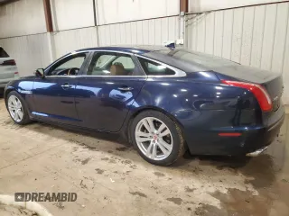 2014 Jaguar XJ Portfolio with VIN SAJWJ2GD7E8V67473, listed as a Copart auction lot 43968705 with 99,146 mi miles and Salvage title. Bid and sale history available at DreamBid. Image 2.