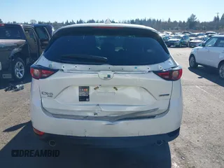 2021 Mazda CX-5 Grand Touring with VIN JM3KFBDM6M0483135, listed as a IAAI auction lot 41590430 with 33,466 mi miles. Bid and sale history available at carsss.com. Image 16.