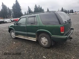1997 GMC Jimmy SLS with VIN 1GKDT13WXV2563104, listed as a Copart auction lot 86317834 with 121,791 mi miles and Salvage Title. Bid and sale history available at carsss.com. Image 2.
