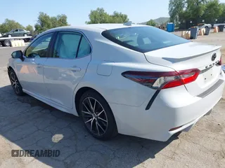2023 Toyota Camry SE with VIN 4T1T11AK8PU138805, listed as a IAAI auction lot 41977827 with 19,661 mi miles and . Bid and sale history available at DreamBid. Image 3.