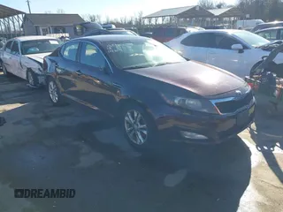 2013 Kia Optima LX z VIN 5XXGM4A71DG186111, wystawiony jako IAAI lot #41189410 z przebiegiem 214 084 mil mil oraz . Historia ofert i sprzedaży dostępna na DreamBid. Obrazek 1.