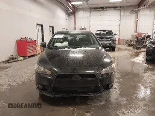 2015 Mitsubishi Lancer SE with VIN JA32V2FW6FU019508, listed as a IAAI auction lot 41633196 with 91,758 mi miles. Bid and sale history available at carsss.com. Image 12.