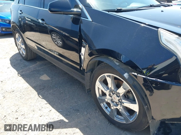 2011 Cadillac SRX Premium Collection z VIN 3GYFNCEY5BS597566, wystawiony jako IAAI lot #41983784 z przebiegiem 102 989 mil mil oraz . Historia ofert i sprzedaży dostępna na DreamBid. Obrazek 13.