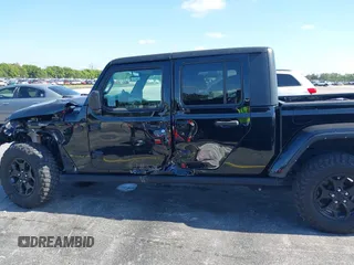 2021 Jeep Gladiator Willys with VIN 1C6HJTAGXML613431, listed as a IAAI auction lot 42180502 with 64,572 mi miles and . Bid and sale history available at DreamBid. Image 14.