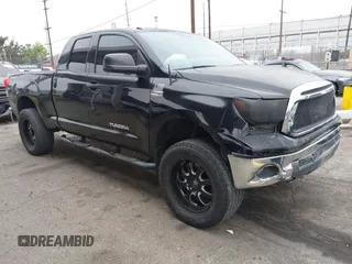 2012 Toyota Tundra z VIN 5TFUY5F14CX231437, wystawiony jako IAAI lot #42106274 z przebiegiem 198 516 mil mil oraz . Historia ofert i sprzedaży dostępna na DreamBid. Obrazek 1.