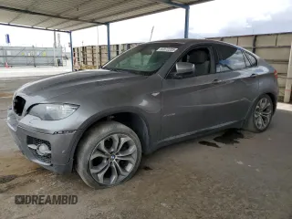 2012 BMW X6 50i z VIN 5UXFG8C53CL590742, wystawiony jako Copart lot #52072205 z przebiegiem 98 177 mil mil oraz Tytuł czysty. Historia ofert i sprzedaży dostępna na DreamBid. Obrazek 1.