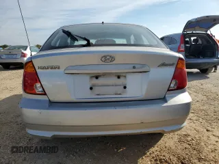 2004 Hyundai Accent GL with VIN KMHCG35C94U292013, listed as a Copart auction lot 84253364 with 0 mi miles and Salvage Title. Bid and sale history available at carsss.com. Image 6.