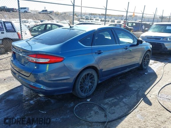2018 Ford Fusion S with VIN 3FA6P0G77JR129224, listed as a IAAI auction lot 41483648 with 104,045 mi miles. Bid and sale history available at carsss.com. Image 4.