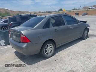 2007 Ford Focus S z VIN 1FAFP34N17W123378, wystawiony jako IAAI lot #42208033 z przebiegiem 183 803 mil mil oraz . Historia ofert i sprzedaży dostępna na DreamBid. Obrazek 4.