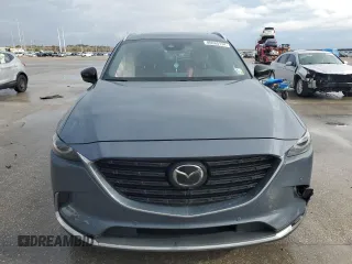 2021 Mazda CX-9 Grand Touring z VIN JM3TCADYXM0519757, wystawiony jako Copart lot #86665134 z przebiegiem 51 217 mil mil oraz Szkoda całkowita • Salvage title. Historia ofert i sprzedaży dostępna na DreamBid. Obrazek 5.