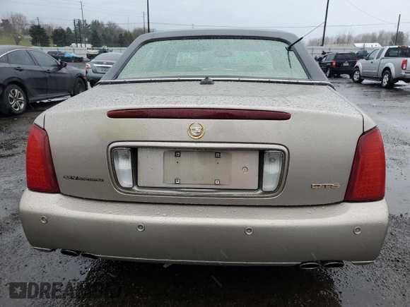 2004 Cadillac DeVille DTS z VIN 1G6KF57944U117834, wystawiony jako Copart lot #89320975 z przebiegiem 149 820 mil mil oraz Szkody całkowita. Historia ofert i sprzedaży dostępna na DreamBid. Obrazek 6.