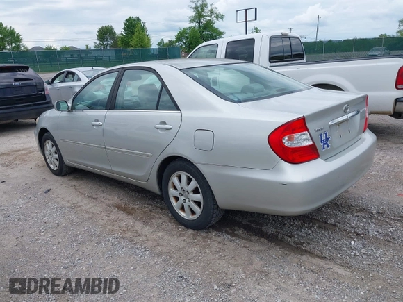 2003 Toyota Camry LE with VIN 4T1BE30K13U168509, listed as a IAAI auction lot 42220735 with 210,328 mi miles and . Bid and sale history available at DreamBid. Image 3.
