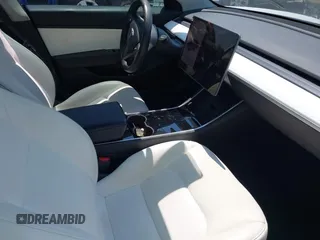 2019 Tesla Model 3 Long Range with VIN 5YJ3E1EB4KF494432, listed as a IAAI auction lot 42009327 with 121,954 mi miles and . Bid and sale history available at DreamBid. Image 5.