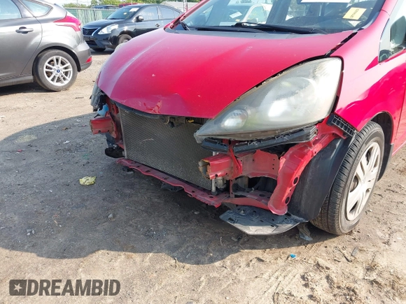 2009 Honda Fit z VIN JHMGE88219S023503, wystawiony jako IAAI lot #42376165 z przebiegiem 142 166 mil mil oraz . Historia ofert i sprzedaży dostępna na DreamBid. Obrazek 6.