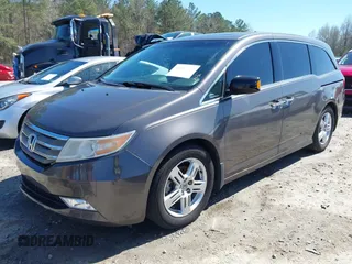 2012 Honda Odyssey Touring with VIN 5FNRL5H91CB057344, listed as a IAAI auction lot 41835272 with 158,854 mi miles. Bid and sale history available at carsss.com. Image 2.