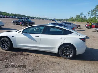 2023 Tesla Model 3 with VIN 5YJ3E1EA9PF557880, listed as a IAAI auction lot 42481413 with 40,582 mi miles and . Bid and sale history available at DreamBid. Image 13.